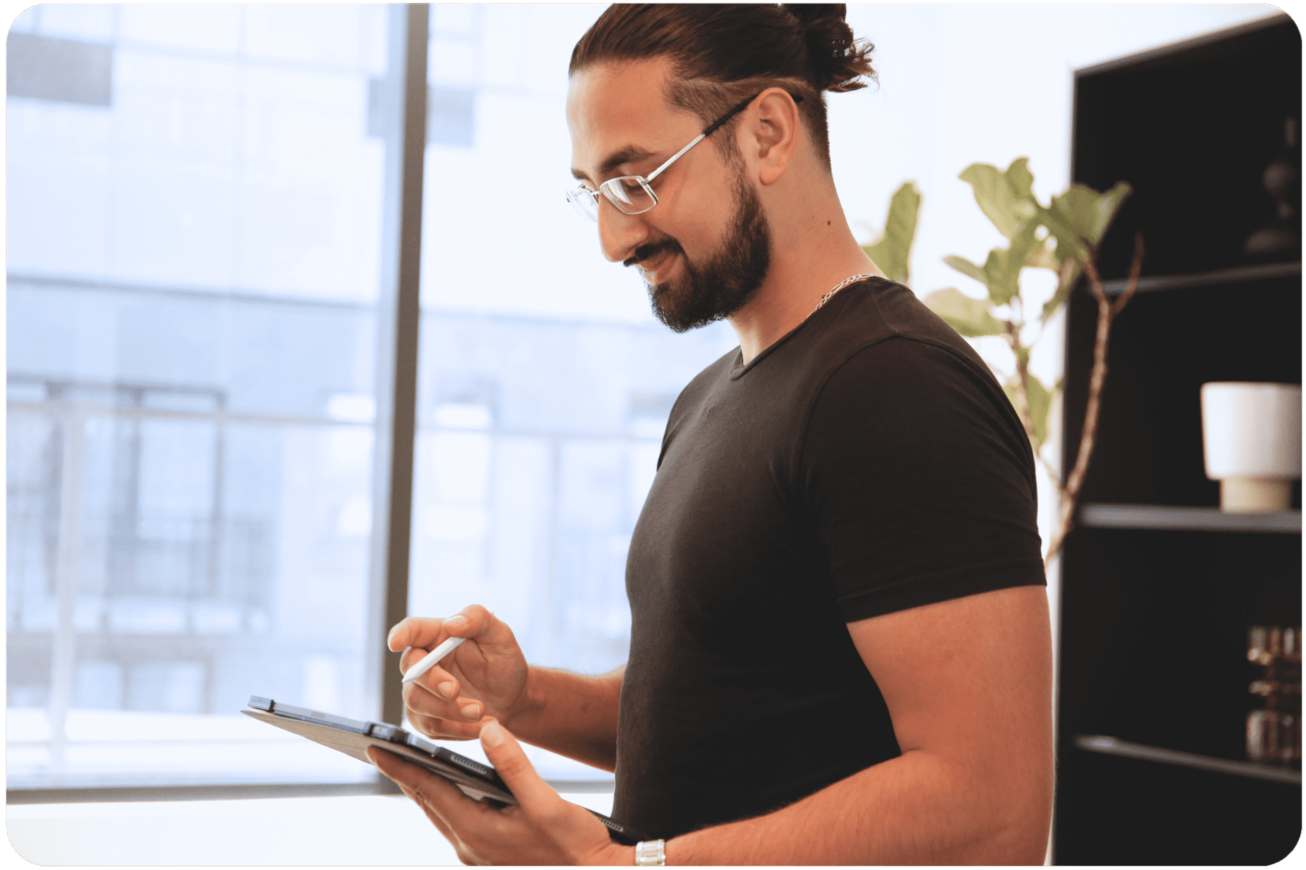 PrepKingz founder Mr. FBA working on a tablet in a modern office